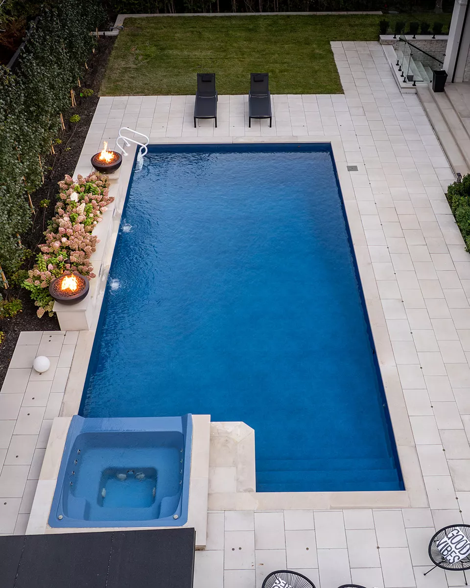 Vinyl liner pool with patterned interior and backyard setting